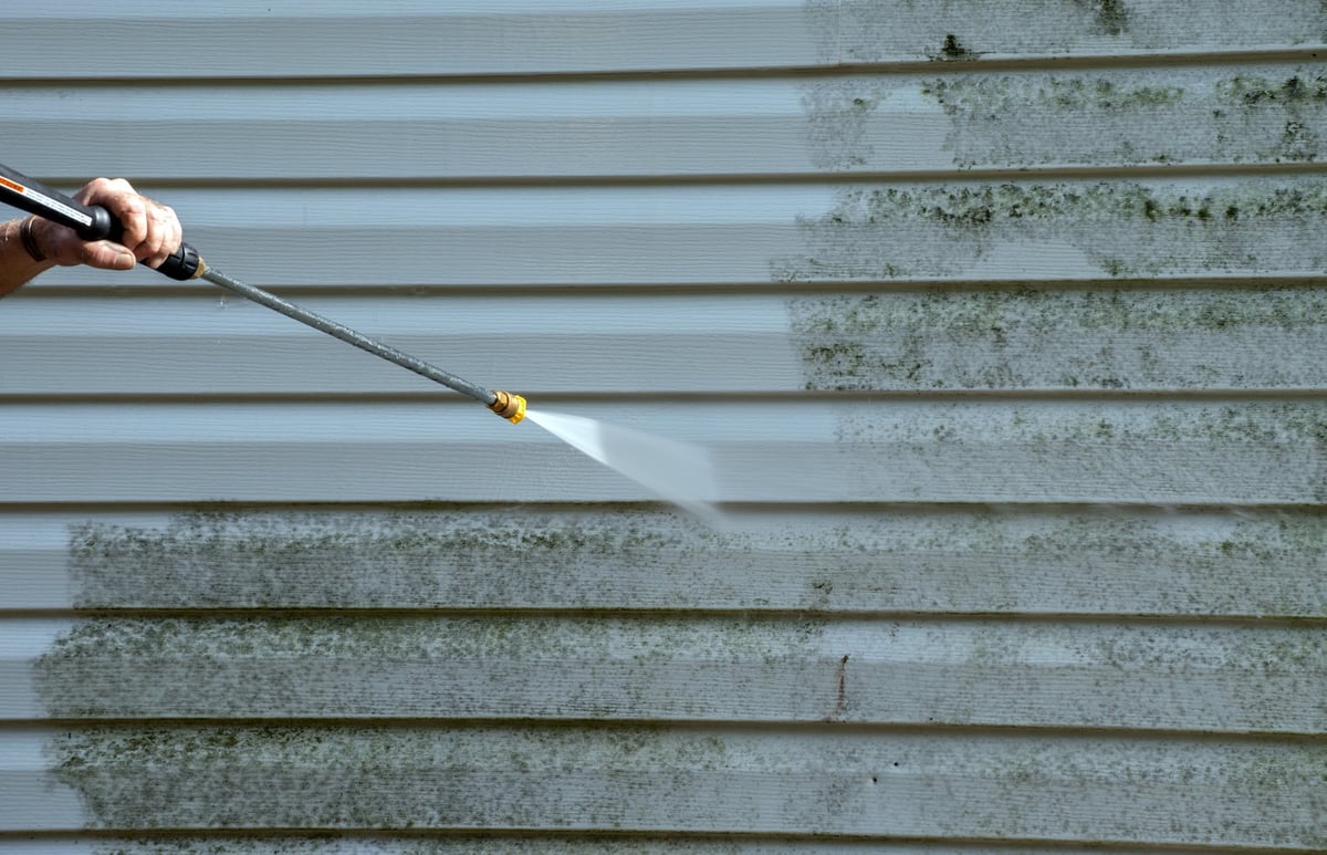 Professional soft washing of house exterior siding