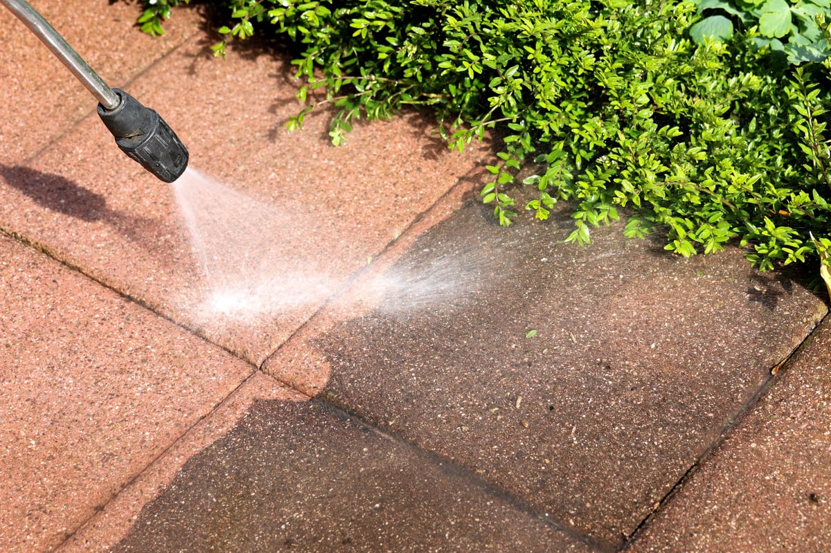Professional roof cleaning using soft wash equipment
